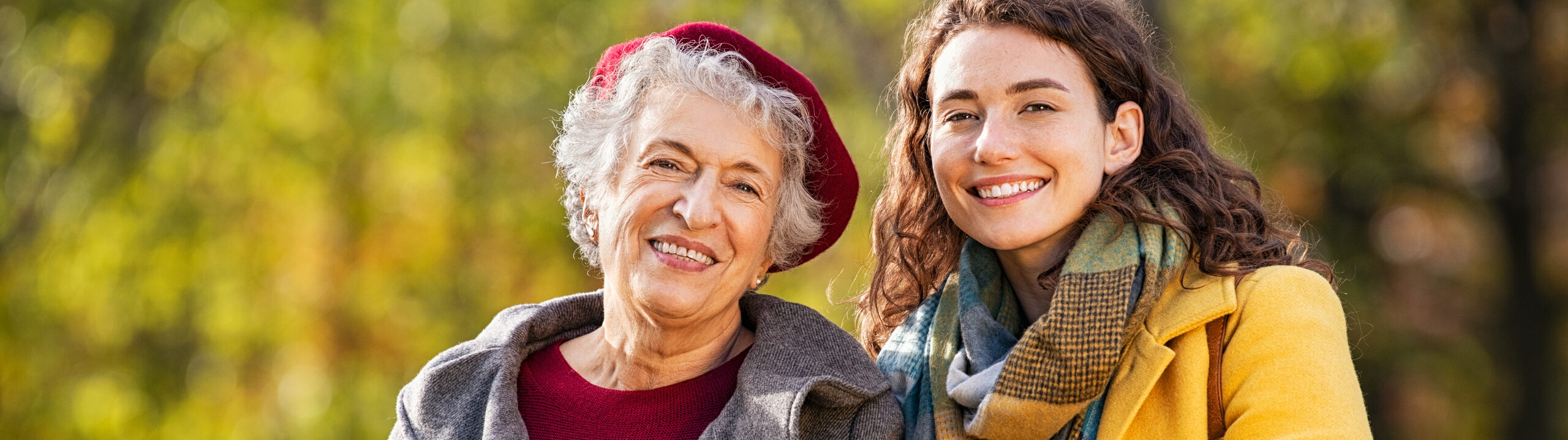 Portrait,Of,Senior,Woman,In,Park,Walking,With,Smiling,Granddaughter.